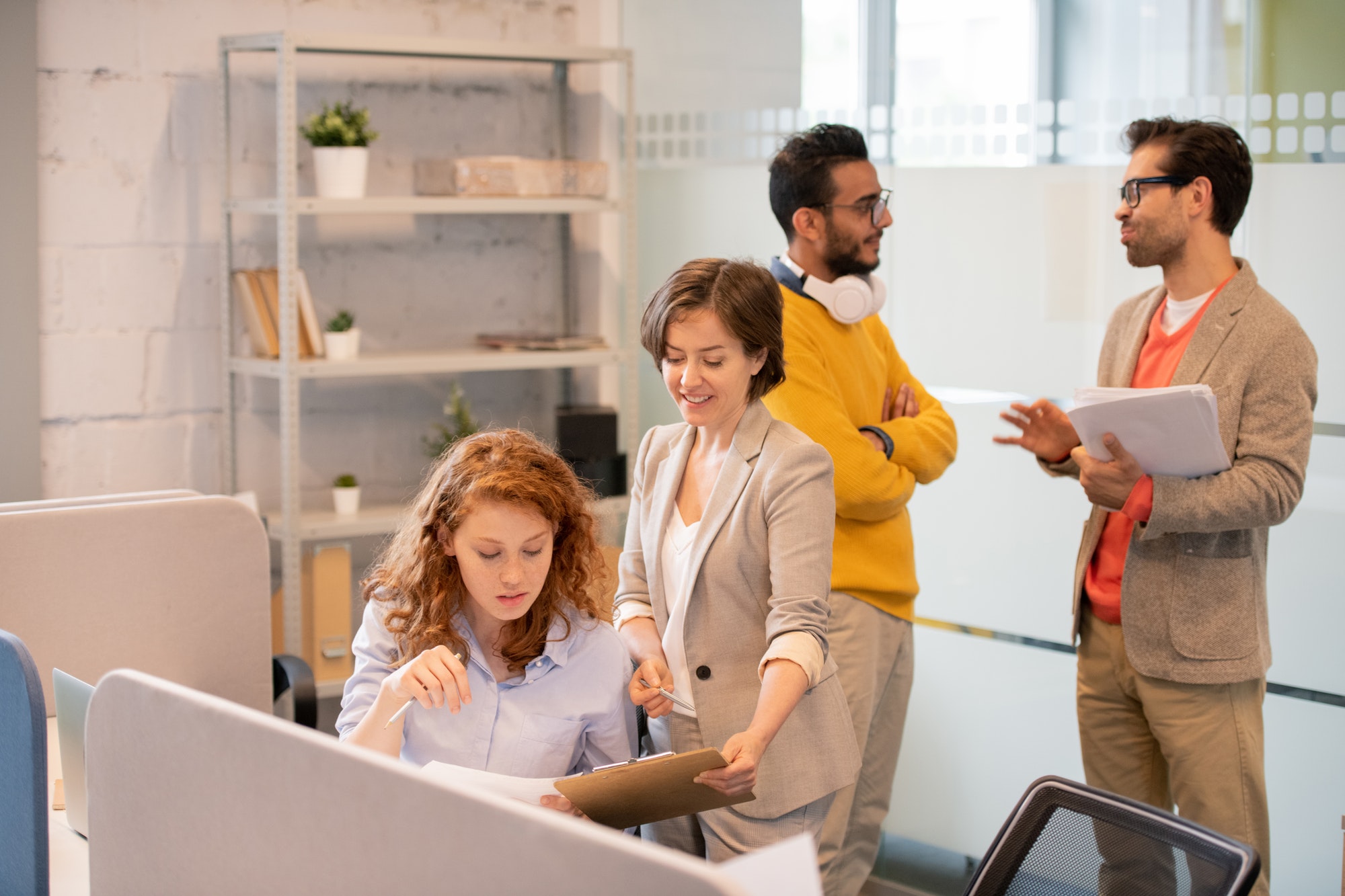 Creative employees working with data in office