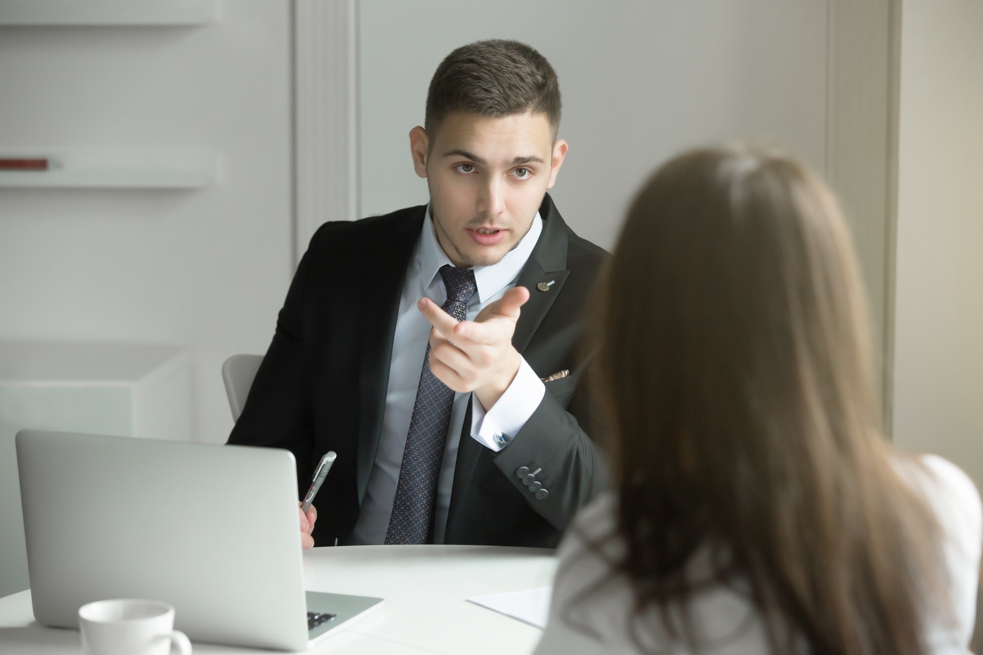 Two business people talking at the office desk